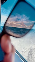 Polarized effect of sunglasses on clouds sea in boat moving