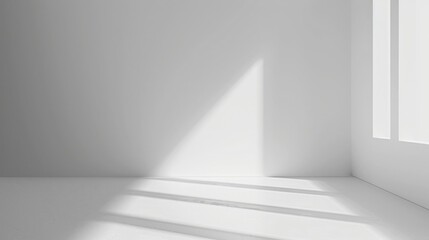 A minimalistic background featuring a smooth, light grey color with ample white space for text or graphics