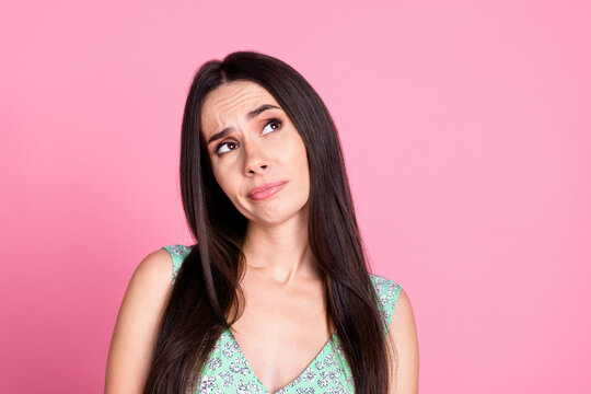 Photo of lovely minded woman wear trendy clothes look empty space news isolated on pink color background