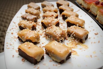 Plate of tasty caramel dessert on the table during the event