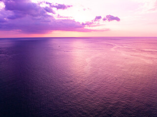 Aerial view sunset sky, Beautiful Light Sunset or sunrise over sea,Colorful dramatic majestic scenery sunset Sky, Amazing clouds and small waves in the ocean, Wonderful light cloud background