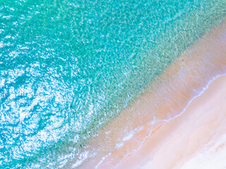 Amazing Top view sea beach landscape background,Summer sea waves crashing on sandy shore seascape background,High angle view ocean nature background