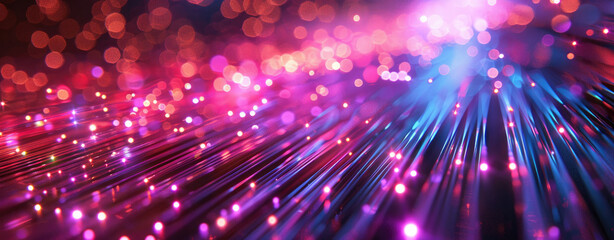 Futuristic abstract background with colorful light rays and glowing fiber optic cables illuminating the dark
