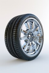 Obraz premium Close-up of a car wheel on a plain white background. Suitable for automotive industry concepts