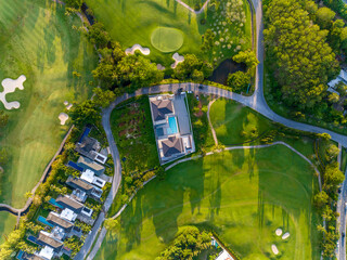 Aerial view of beautiful green golf field fairway and putting green, Top down image for sport...