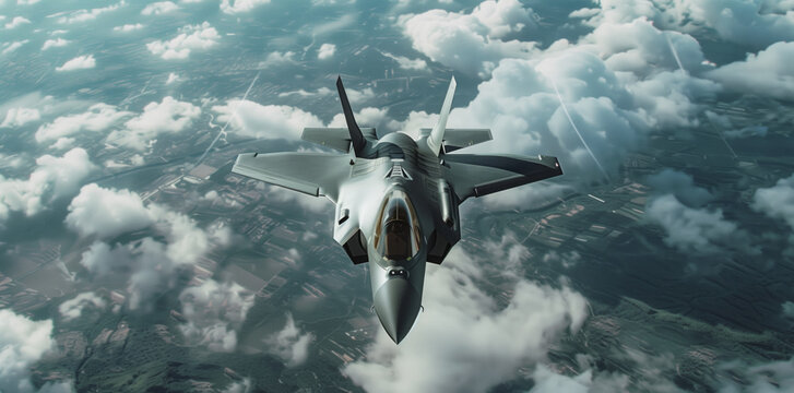 A modern combat fighter in flight above the clouds.