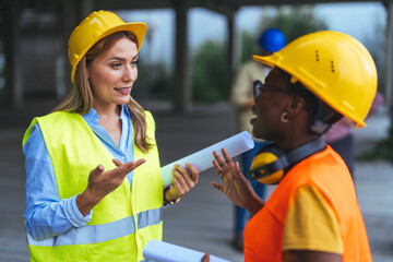 Two Specialists Inspect Commercial, Industrial Building Construction Site. Real Estate Project with...