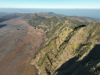 Aerial view Mountains at Bromo volcano during sunny sky,Beautiful Mountains Penanjakan in Bromo Tengger Semeru National Park,East Java,Indonesia.Nature landscape background