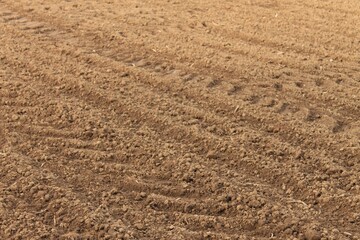 this is a photograph of the dirt on a field that's been plowed