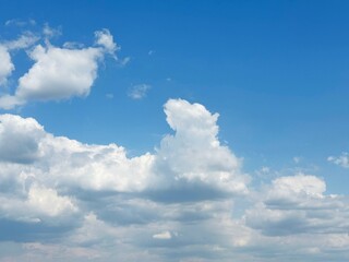 Fluffy clouds in the blue sky.