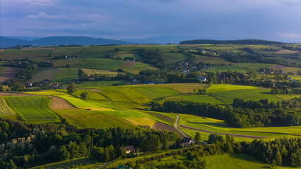 Lesser Poland rolling hills and rural landscape near Ciezkowice. Aerial drone view