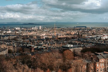 Aerial view of a cityscape of Edinburgh, Scotland on a cloudy day