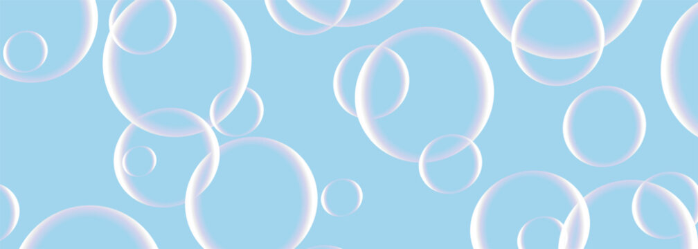 Soap bubbles on wide background in blue pastel colors. Realistic 3d transparent bubbles on vector illustration wide banner.