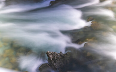 water flowing over rocks, silky water