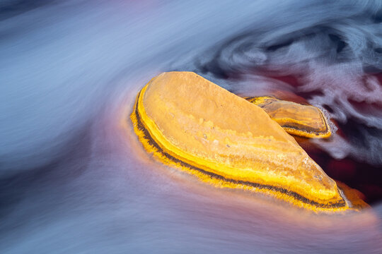 Colorful flowing waters and rocks of Riotinto River