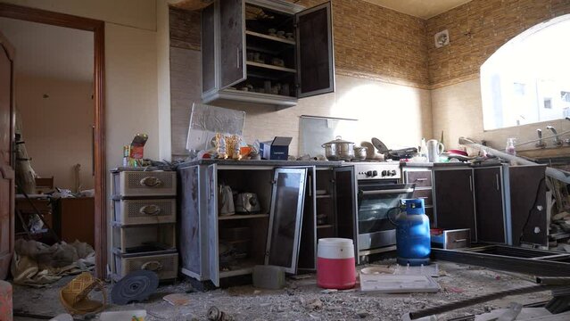 Interiors of vandalized and abandoned house kitchen of a Palestinian family after being bombed during the Israel-Hamas war conflict, Gaza
