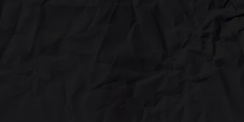 Black crumpled paper texture background.