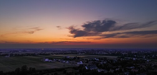 Aerial scenic view of the sunrise over a bustling cityscape
