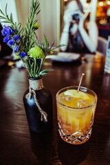 Vertical shot of a glass of sour alcoholic cocktail on the table