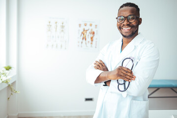  Male african american black professional doctor physician general practitioner wear white medical coat holding stethoscope, medicine and health care concept background, close up view, copy space