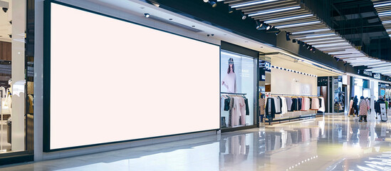 A pristine blank billboard integrated seamlessly into the vibrant atmosphere of a fashion outlet, providing an ideal platform for advertisers to engage shoppers in mesmerizing high.
