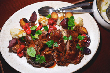 A large plate of grilled meat and vegetables. Meat menu for a cafe or restaurant.