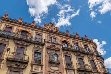 An ancient building in Calle Arfe street, in the historic center of Seville, Spain