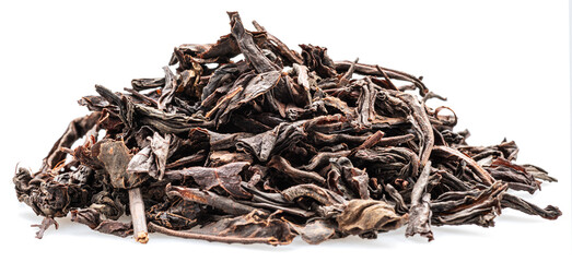 Heap of dried tea leaves isolated on white background. Closeup.