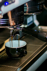 coffee maker pouring espresso