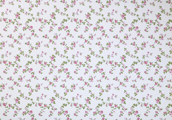 Old wallpaper on the wall. Old wallpaper for texture or background.