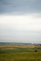 Obraz premium sustainable agriculture Baling hay and silage rolls and bales on a farm