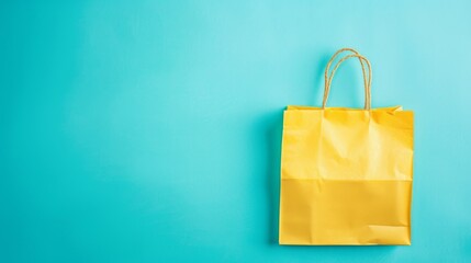 Crumpled yellow paper bag on blue background.