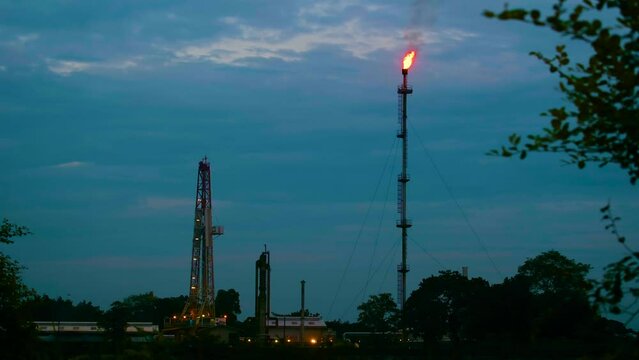 Burning combustion associated gas flare stack tower oil rig refinery plant