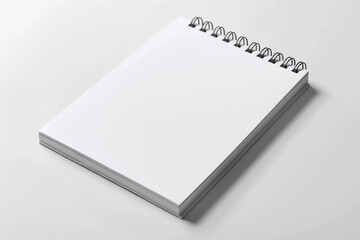 Blank Notepad With Spirals on White Surface