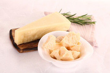 Chopped Italian hard parmesan cheese