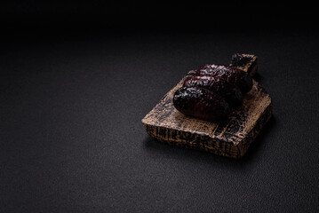 Delicious black blood sausage or black pudding with spices and herbs