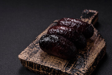 Delicious black blood sausage or black pudding with spices and herbs