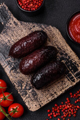 Delicious black blood sausage or black pudding with spices and herbs