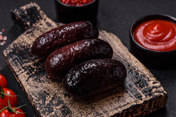 Delicious black blood sausage or black pudding with spices and herbs