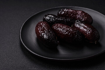 Delicious black blood sausage or black pudding with spices and herbs