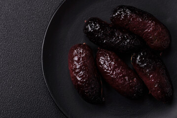 Delicious black blood sausage or black pudding with spices and herbs