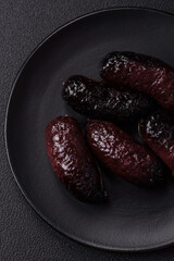 Delicious black blood sausage or black pudding with spices and herbs