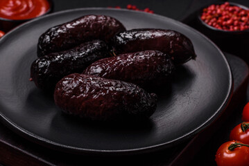 Delicious black blood sausage or black pudding with spices and herbs