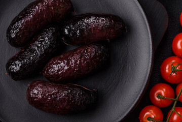 Delicious black blood sausage or black pudding with spices and herbs