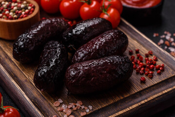 Delicious black blood sausage or black pudding with spices and herbs