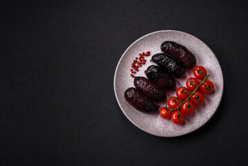 Delicious black blood sausage or black pudding with spices and herbs