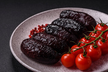 Delicious black blood sausage or black pudding with spices and herbs