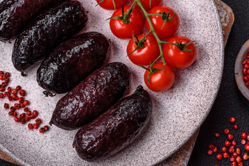 Delicious black blood sausage or black pudding with spices and herbs