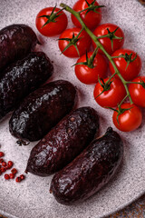 Delicious black blood sausage or black pudding with spices and herbs