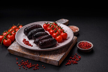 Delicious black blood sausage or black pudding with spices and herbs